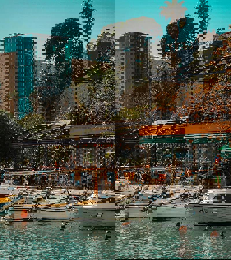 Budva Marina with yachts and Adriatic coastline Montenegro