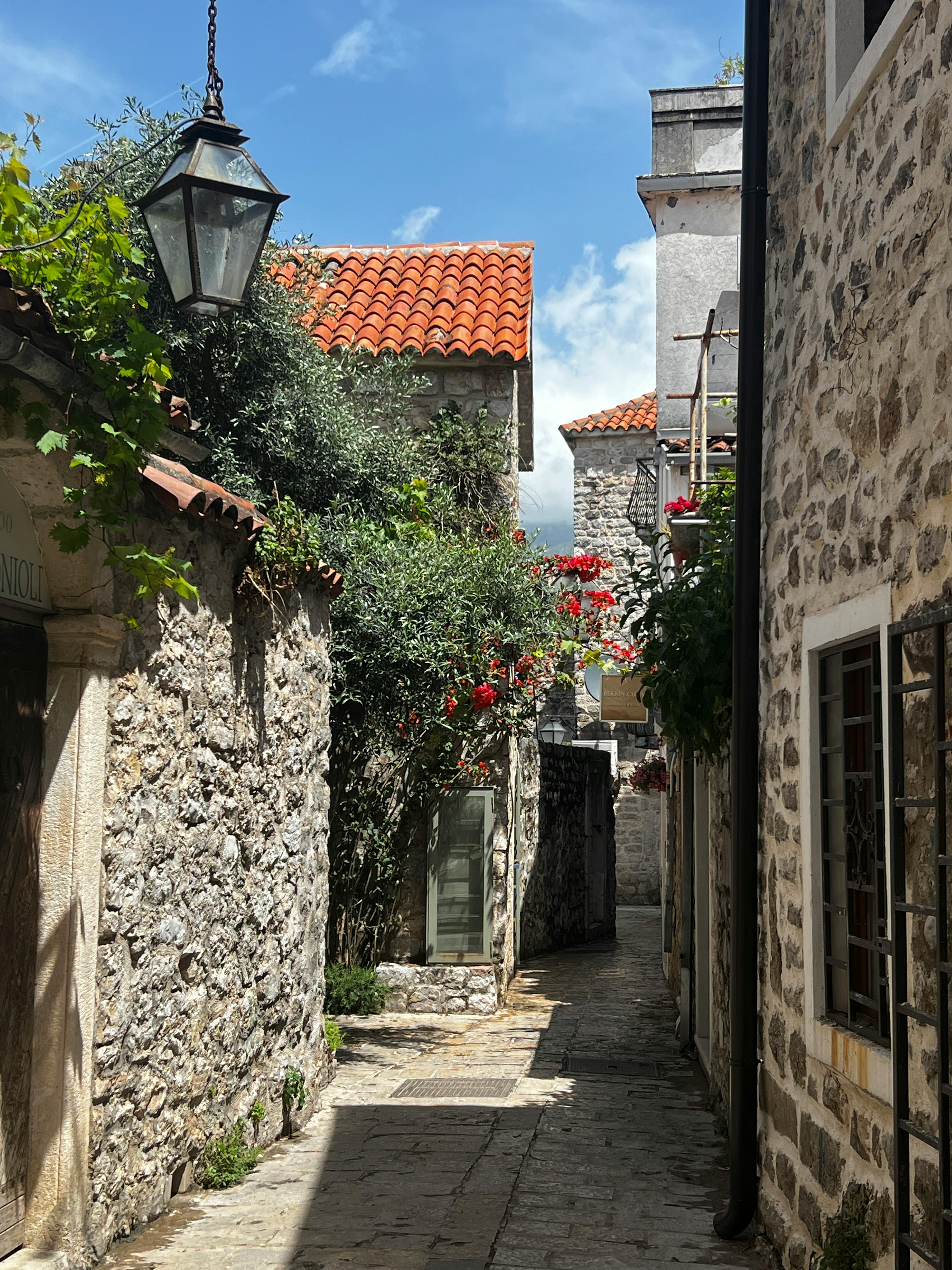 Budva Old Town street with stone houses and traditional Mediterranean architecture